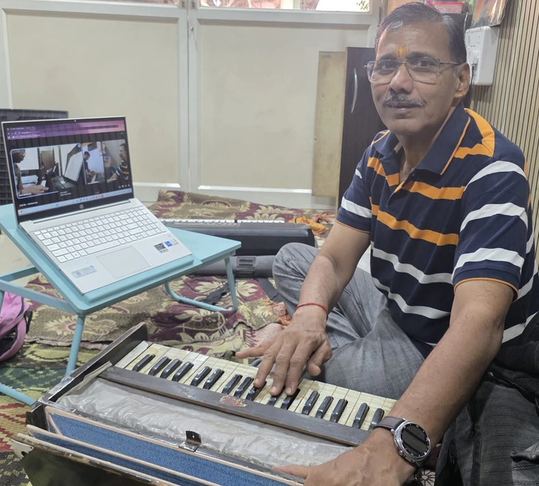 Mr. Shirish Chandolikar — Founder, Sai Kala Sangeet Classes, teaching harmonium